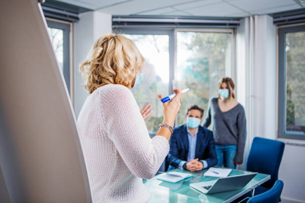 istock Education classroom setting with female student and teachers during the Covid-19 pandemic 1283220049