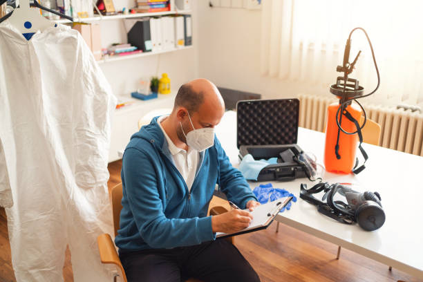 istock Caucasian man with face mask holding planner at his office 1283221306