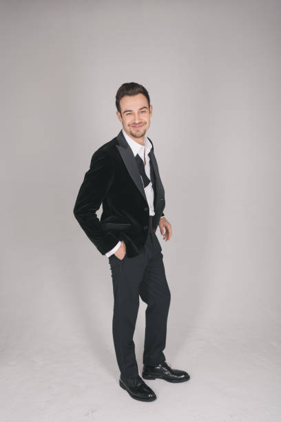 istock Studio portrait of a young man in a tuxedo against plain studio background 1283221572