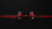Happy Black Friday Written Black Ribbon over Black Background