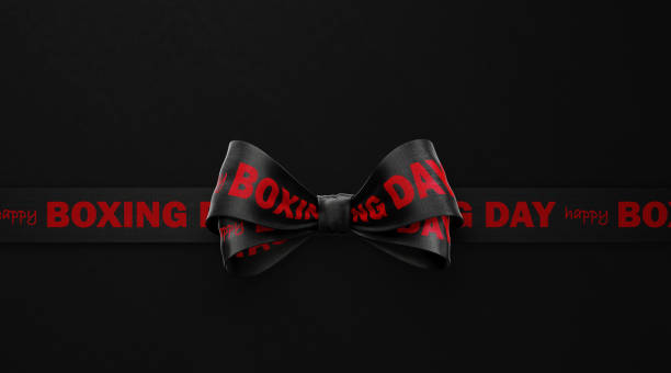 Happy Boxing Day written black ribbon over black background. Horizontal composition with copy space. Boxing Day concept.