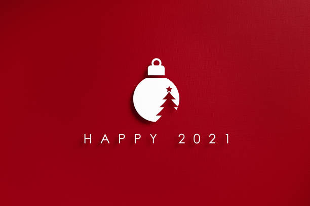 istock White Cutout Bauble and Happy 2021 Message Over Red Background 1283223701