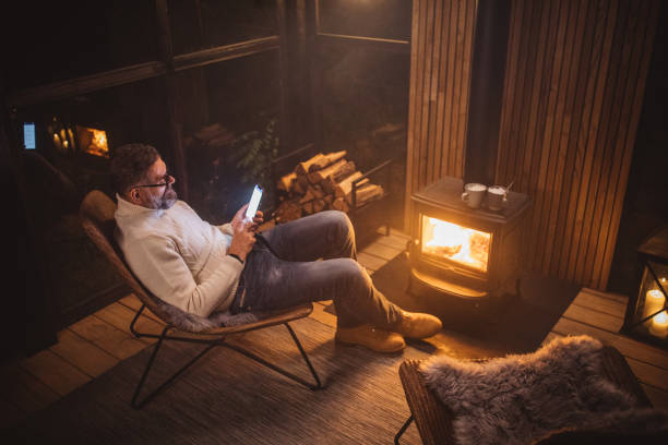 enjoying in winter night - forest sitting men comfortable imagens e fotografias de stock