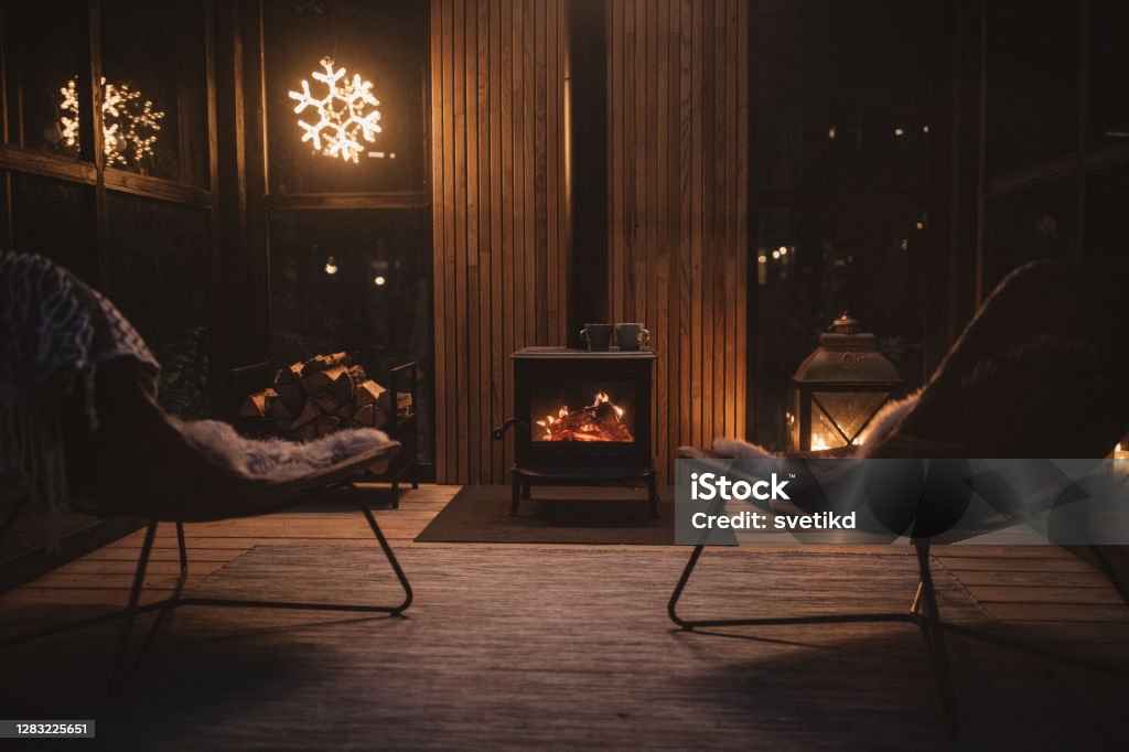 Cozy place for rest Cozy living room winter interior with fireplace Fireplace Stock Photo Cozy place for rest Cozy living room winter interior with fireplace Fireplace Stock Photo