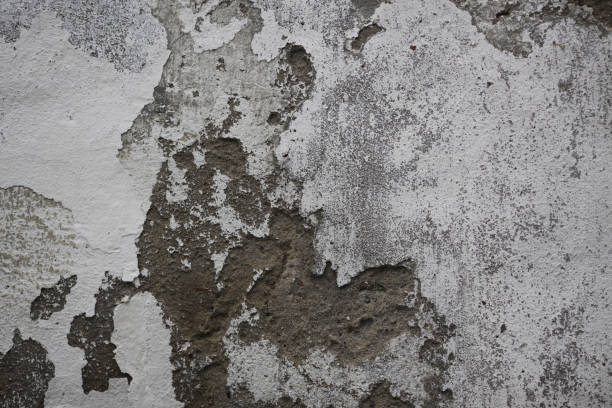istock Texture of rough plaster on the wall and cracks 1283225753