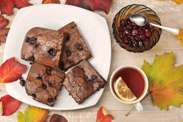 istock brownie pieces with cherries and tea cup on a wooden background 1283226113