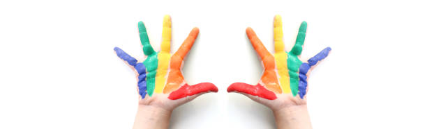 istock Banner. Rainbow painted hand shape isolated on white 1283229419