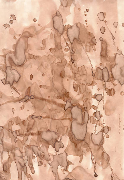 istock Vintage paper background isolated. The old paper texture is light brown with a lot of chaotically scattered drops of splashes of a darker brown color . paper colored with coffee 1283229638