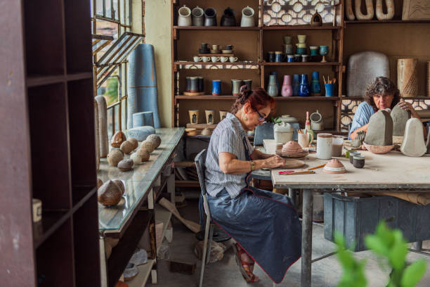 istock Senior women working in pottery studio 1283234861
