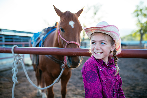 Young girls learning horseback riding on the ranch in Utah, USA