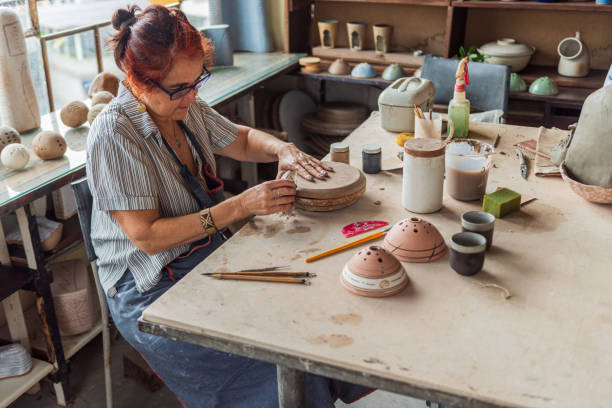 istock Senior women working in pottery studio 1283236295