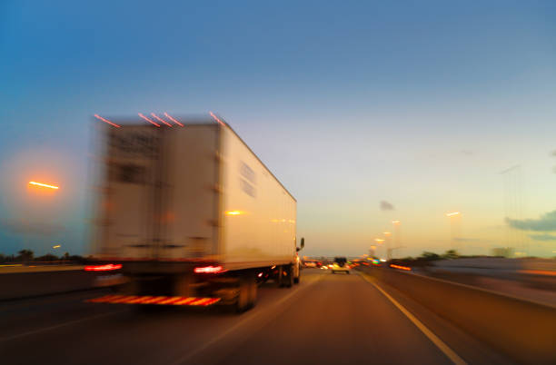 White semi truck at sunset in a MIami highway