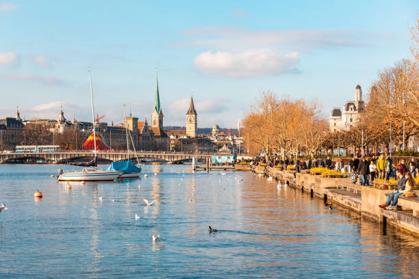 istock Zurich beautiful panoramic view on a sunny day with people walking on lakeside 1283241579