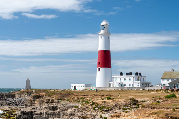 Portland Bill lighthouse in Dorset Landscape photo of Portland Bill lighthouse on the Jurassic coast in Dorset bill of portland stock pictures, royalty-free photos & images