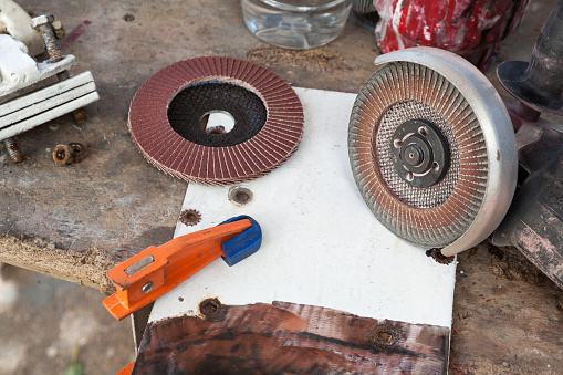 Angle grinder with other tool on a table