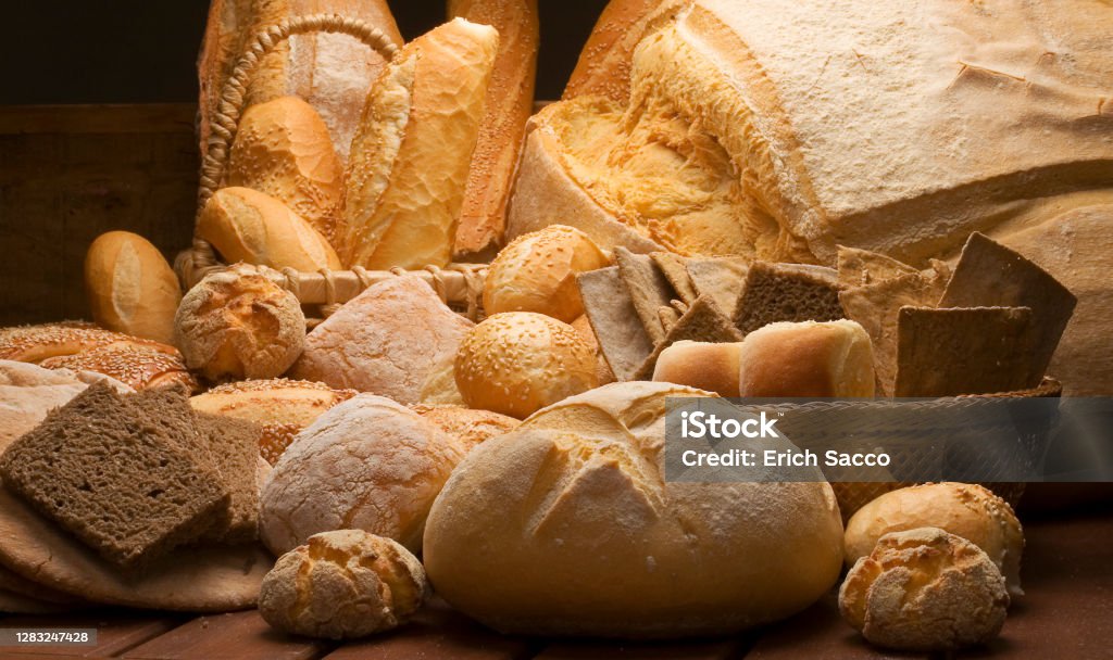 table decorated with various artisan breads produced with studio light. Bread Stock Photo
