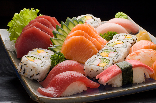 typical Japanese food in decorated and colorful dishes, Sushi and Sashimi.