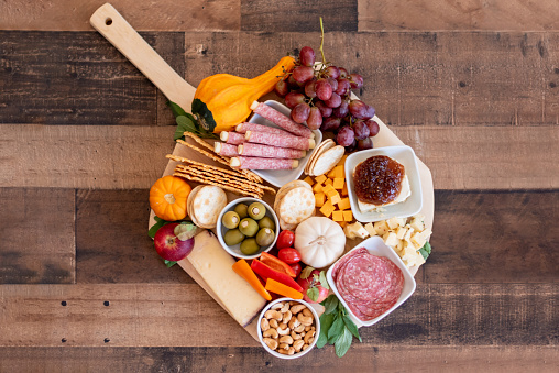 Charcuterie board with cheese and snacks for holiday entertaining