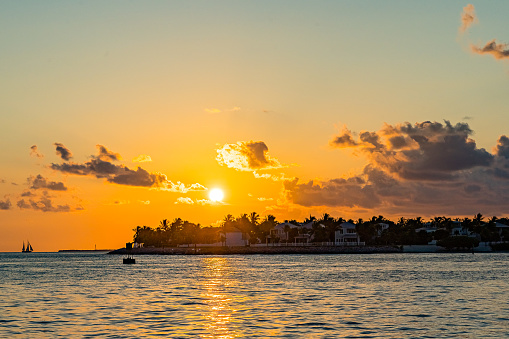 Sunset, view of Sunset y Island from Mallory Square, Key West, Florida, US.