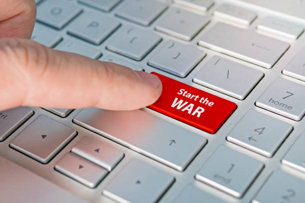 istock beginning of the third world war. Start war inscriptions on the grey silver keyboard button close up 1283257227