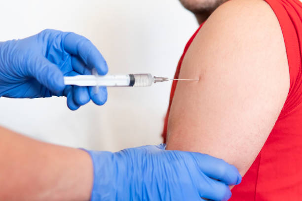 close-up of doctor making vaccination to the patient on white background, healthy concept. prevention of spread of coronavirus infection covid 19 - deltoid imagens e fotografias de stock