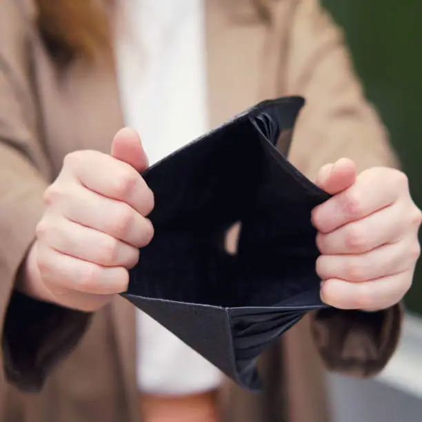 Photo of Teacher with hole in wallet no money, concept. School quarantine education concept