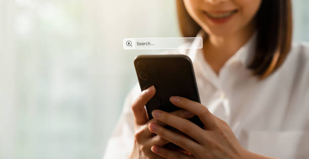 istock Smile woman hand using smartphone and press screen to search Browsing on the Internet online. 1283264303