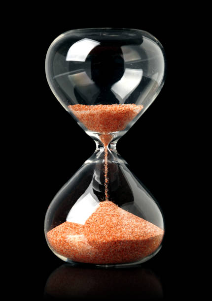 istock Hourglass with red sand showing the passage of time 1283265018