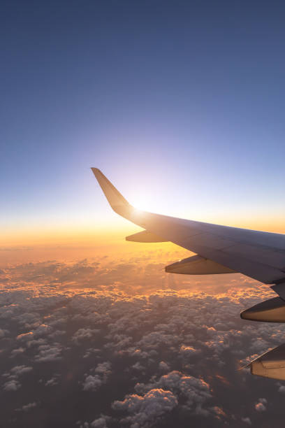 istock The airplane flew over the clouds 1283267083