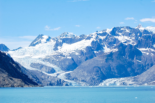 The ancient glacier makes its way down the mountain and into the Prince William Sound.  The mountain range has been scarred from years of pressure and ice.