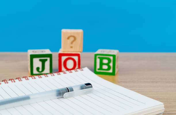 istock Wooden word job and note pad on the table 1283275744