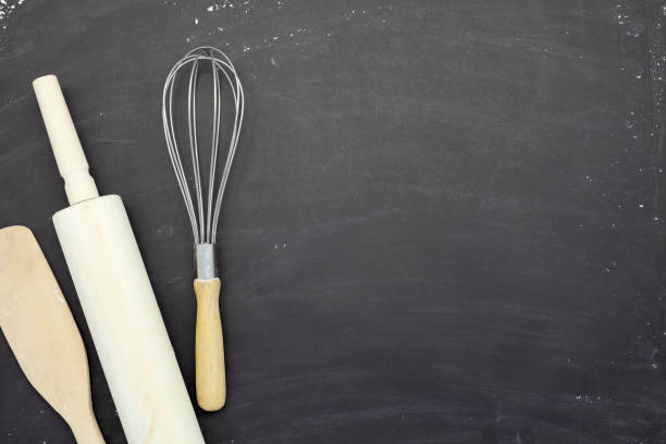 istock Sprinkle wheat flour with rolling pin ,wooden spoon and  Dough preparing copy space for text on dark black wood background, top view for cooking dough or pastry background,Bakery tools on flour background. 1283275967