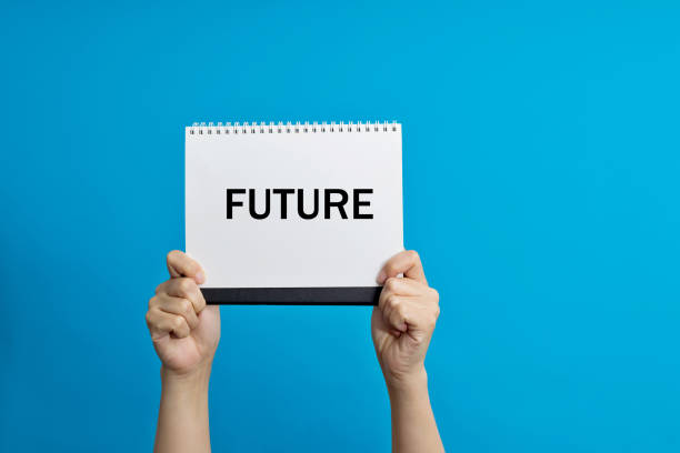 istock Woman hand holding a paper with word future 1283277382