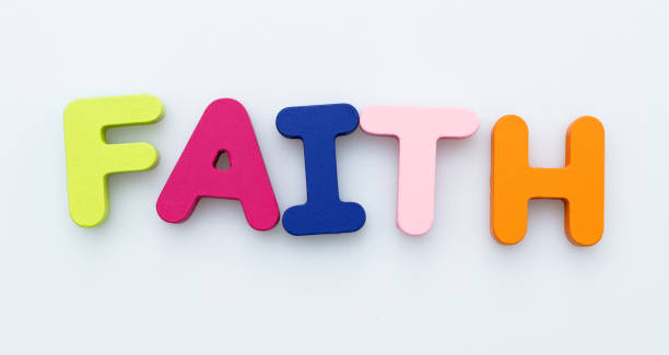 istock Wooden word faith on white background 1283277571