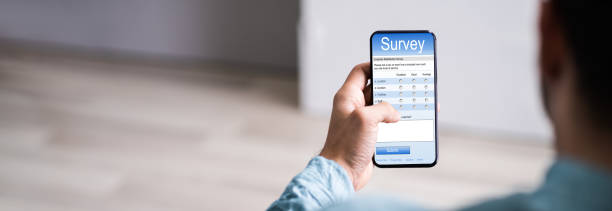 istock Man Filling Online Survey Form 1283281143