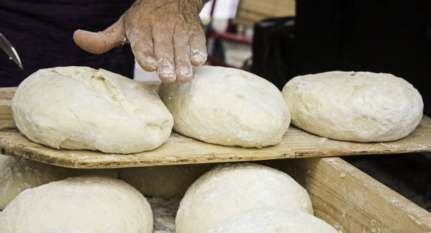istock Bakers kneading bread dough in the traditional way 1283283069