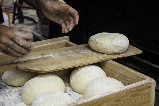 istock Bakers kneading bread dough in the traditional way 1283283070