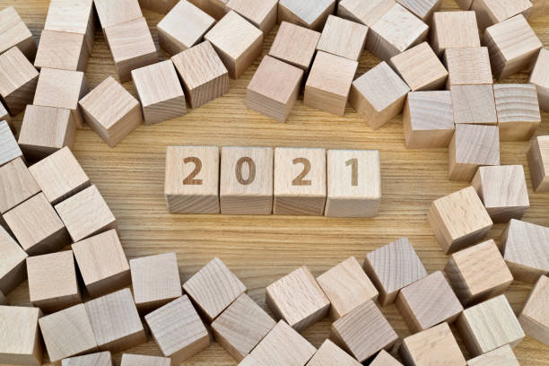 istock Wooden cubes with word 2021 1283283790