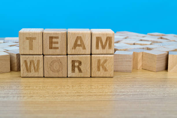 istock Wooden blocks with word teamwork 1283284409