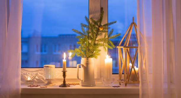 istock Christmas evening windowsill with burning candles 1283287350