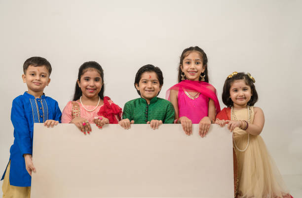 istock Group of children holding white board in studio 1283289098