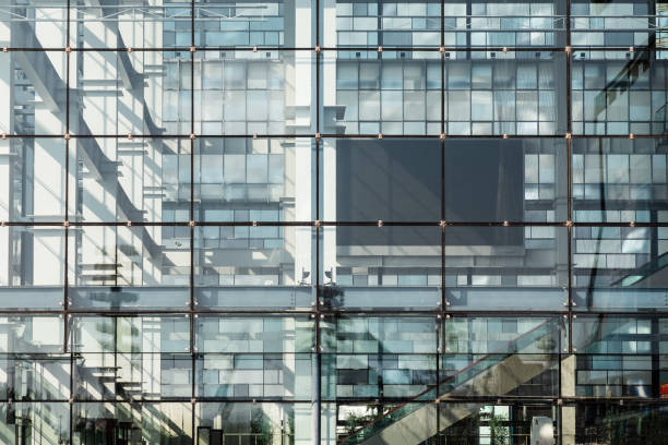 istock Closeup modern blue glass building 1283297270