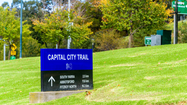 The blue and black sign for the Capital City Trail The blue and black sign for the Capital City Trail next to the Yarra River in the city of Melbourne, Australia south yarra stock pictures, royalty-free photos & images