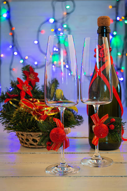 istock New Years background with two champagne glasses and Christmas lights 1283300539