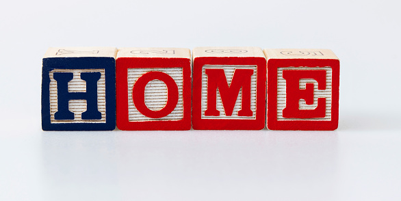Wooden blocks with word home.