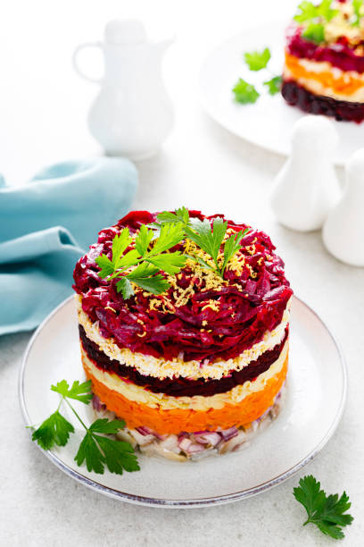 istock Layered shuba salad. Dressed herring, herring under a fur coat. Festive Christmas vegetable salad with fish and boiled vegetables. 1283301964