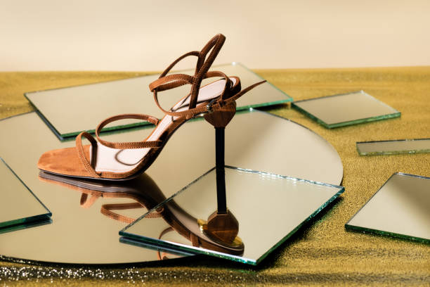 istock brown suede elegant heeled sandals on mirror surface 1283302978