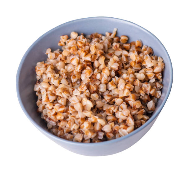 istock buckwheat in a plate isolated on white background. buckwheat top view. 1283304083