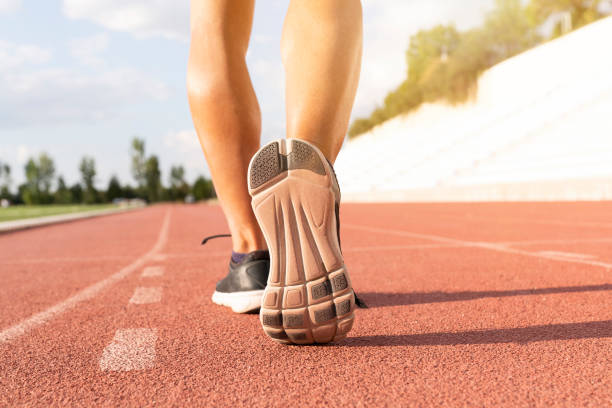 istock athlete man foot walking. 1283307483