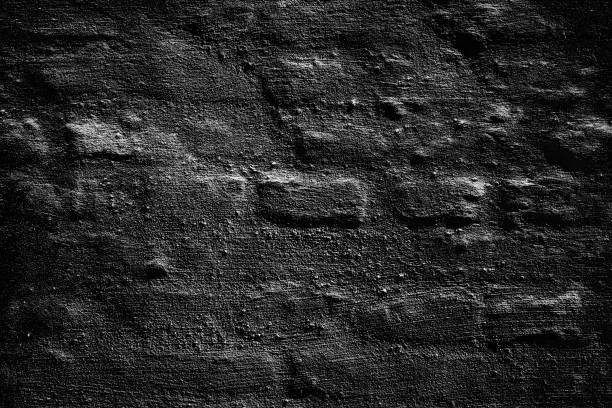 istock Black texture of an old brick wall. Backgrounds. 1283307547